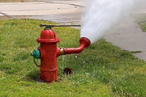 depositphotos_539805816-stock-photo-fire-hydrant-process-being-flushed